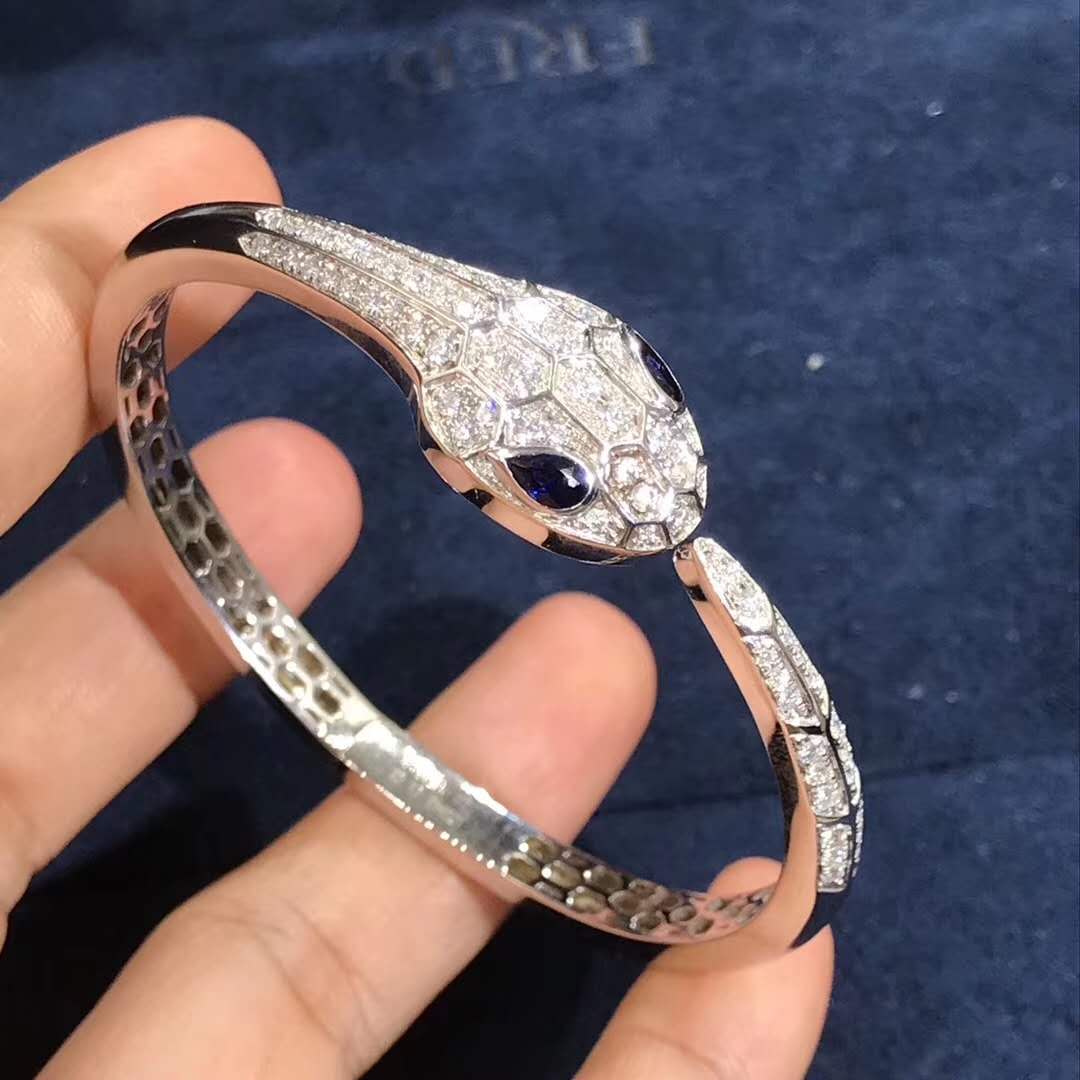 Bulgari Serpenti bangle bracelet in 18kt white gold set with blue sapphire eyes and pavé diamonds BR858110