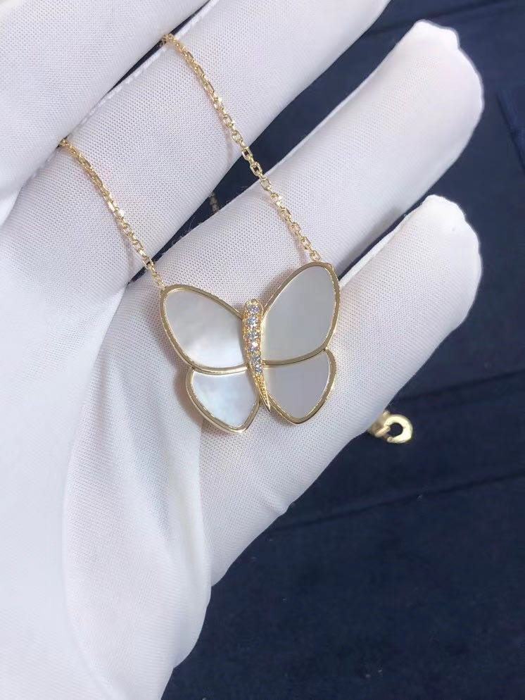 Van Cleef & Arpels Butterfly Pendant in 18k Yellow Gold with White Mother-of-Pearl and Round Diamonds